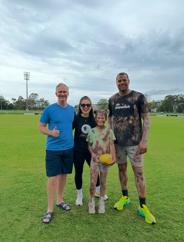 Buddy Franklin with Marianna Psaltis and performers Andrew Foley and Hannah Wecker on set for AFL Australia Campaign